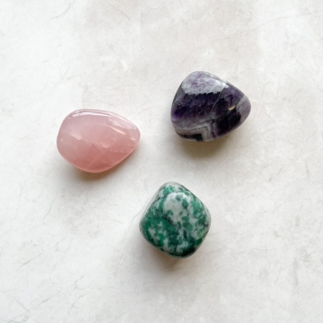 The star sign Aquarius and the crystals Rose Quartz, Green Jade, and Amethyst: