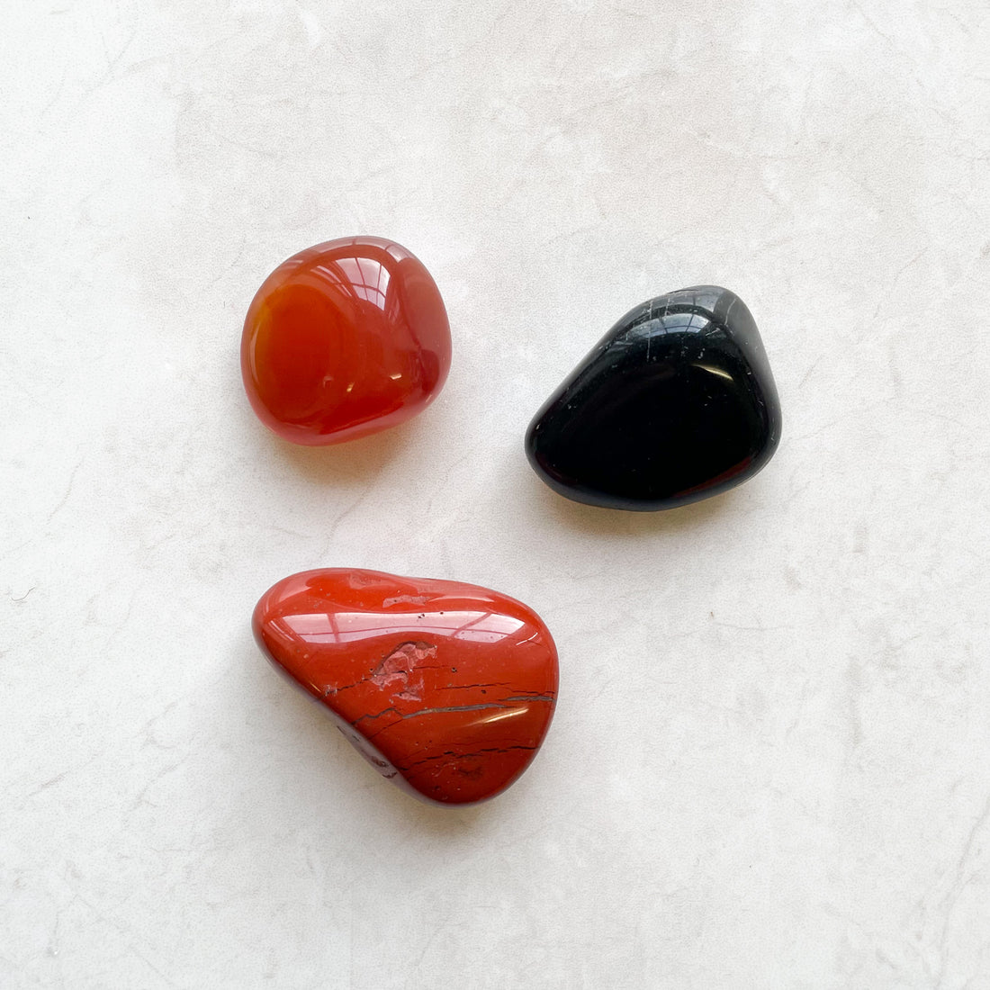 Fiery sign Aries and black obsidian, carnelian, and red jasper.