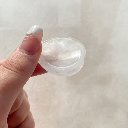 a clear white heart shaped worry stone