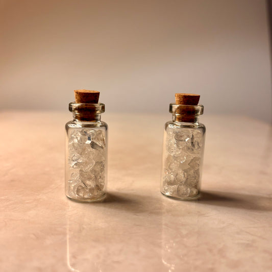 2 mini wish bottles with clear quartz crystal chips inside with cork lids