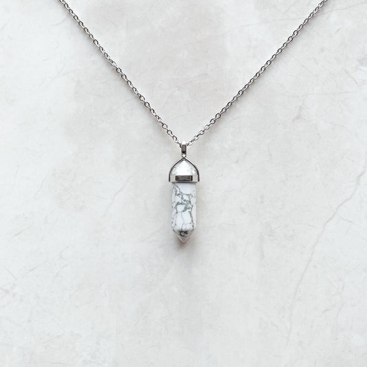 grey and white marble crystal on a necklace